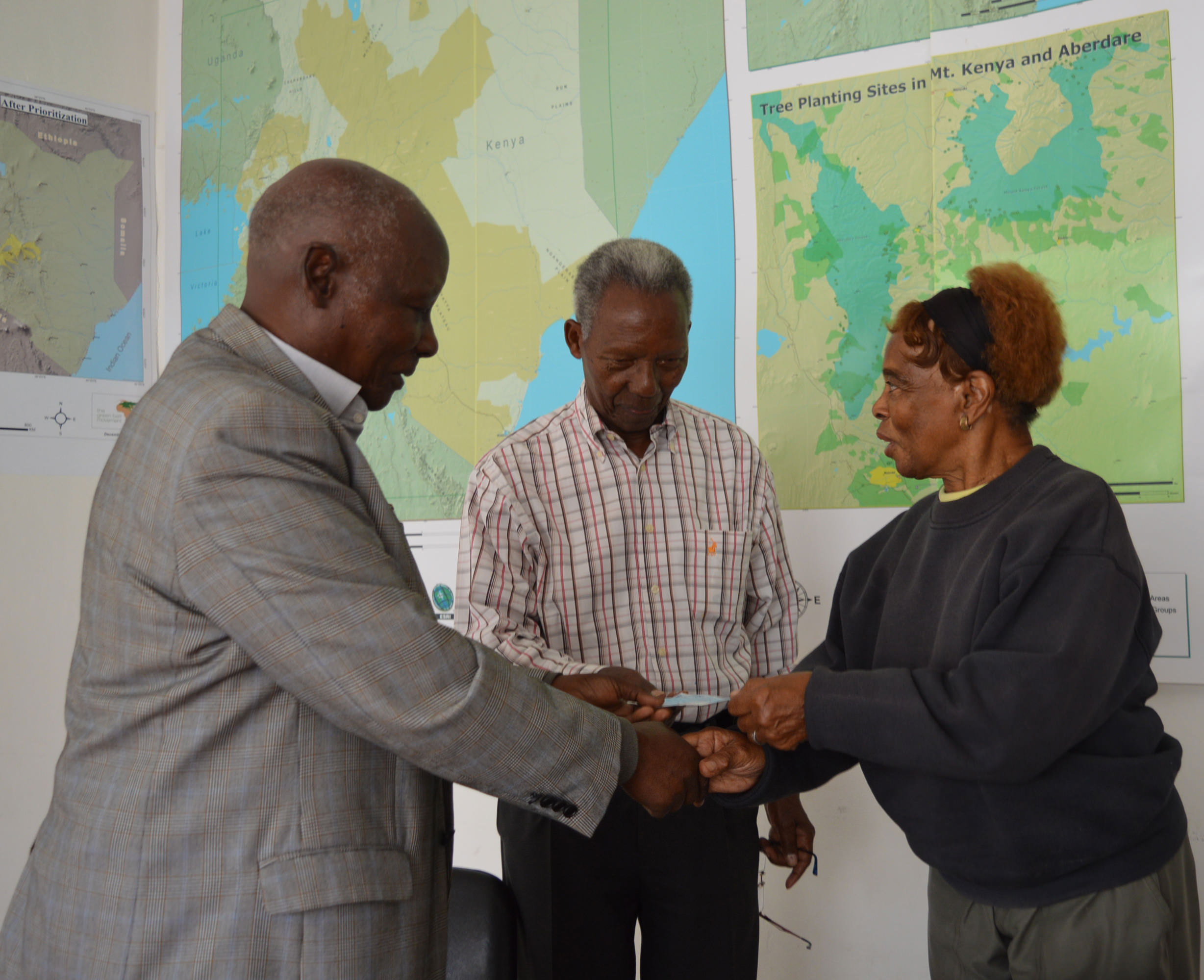 Prof. Vertistine Mbaya receives the cheque on behalf of Green Belt Movement